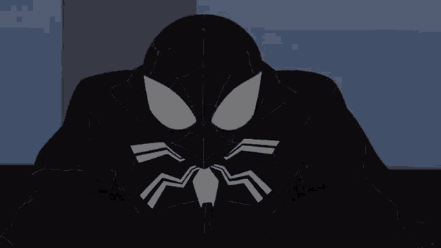 a close up of a spider man 's face with a white spider on it