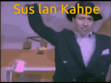 a man in a tuxedo and hat with the words sus lan kahpe on the bottom