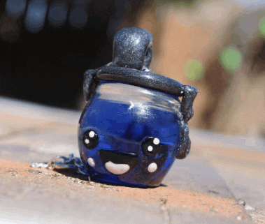 a blue bottle with a face and headphones on it
