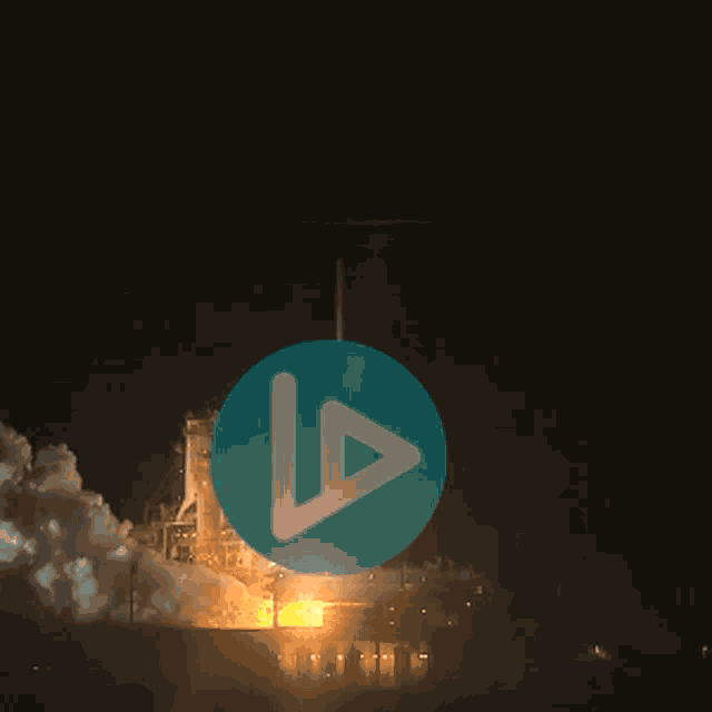 a picture of a rocket being launched at night with a play button