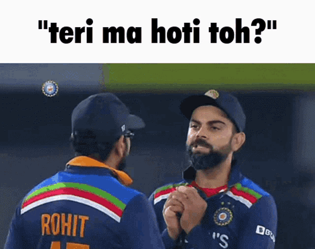 two cricket players are standing next to each other and one of them has the name rohit on his shirt