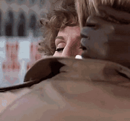 a close up of a man and a woman 's faces