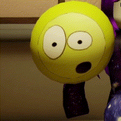 a yellow ball with white eyes and a surprised face on it