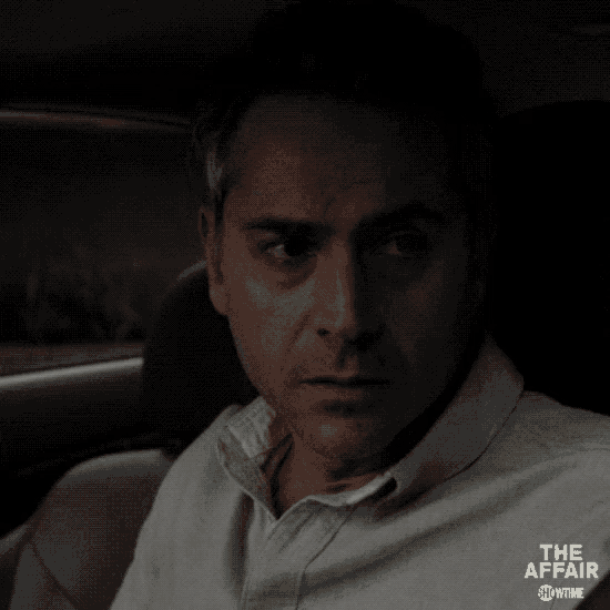 a close up of a man in a car with the affair showtime written on the bottom