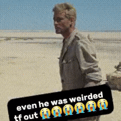 a man is holding a sign that says even he was weirded tf out .