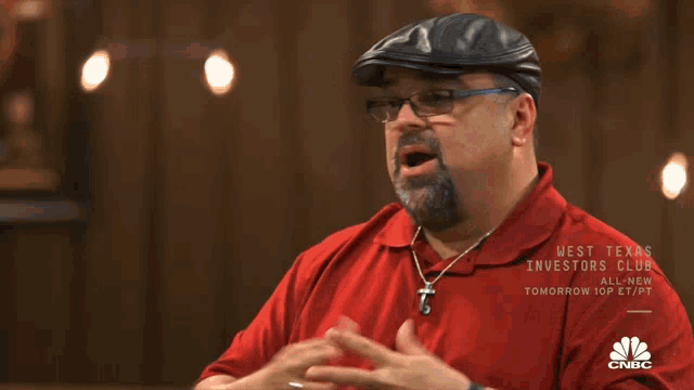 a man in a red shirt is on cnbc 's west texas investor club