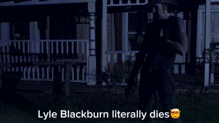 a man standing in front of a house with the words lyle blackburn literally dies below him