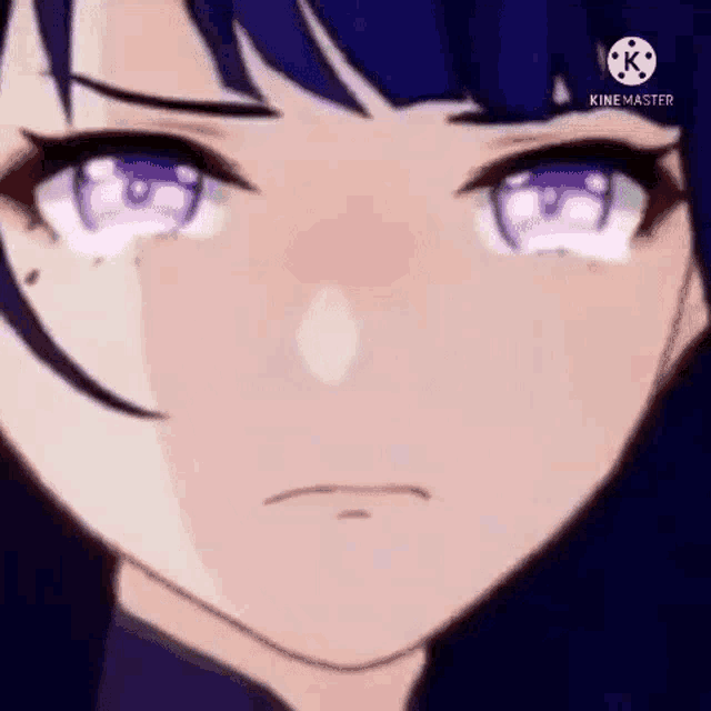 a close up of a person 's face with purple eyes and a sad look on their face .