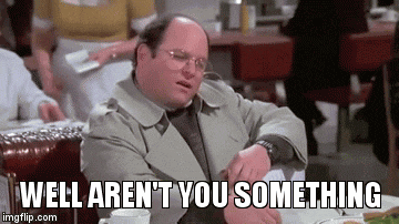 a man is sitting at a table in a diner looking at his watch and saying well aren 't you something .
