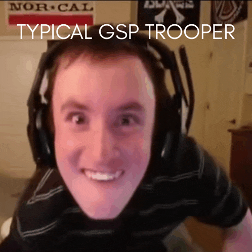 a man wearing headphones is smiling with the words typical gsp trooper behind him
