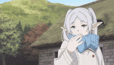 a girl with white hair and ears is wearing a scarf around her neck