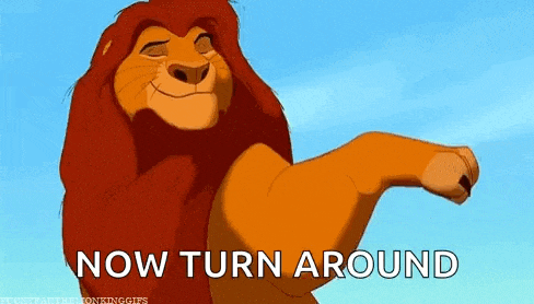 a lion from the lion king is smiling and flexing its muscles .