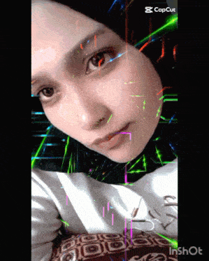 a woman 's face is displayed on a screen with the caption capcut