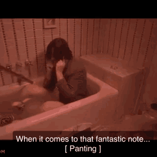 a man is sitting in a bathtub talking on a cell phone and says when it comes to that fantastic note .