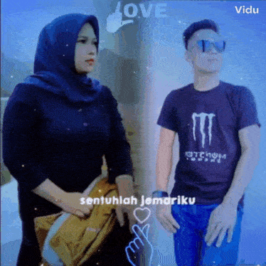 a man and a woman are standing next to each other wearing monster shirts .