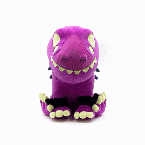 a purple stuffed dinosaur with a black tail
