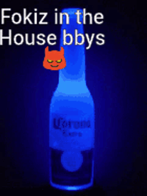 a bottle of corona extra beer with a devil on it