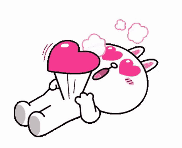 a cartoon cat is laying on the floor holding a pink heart in front of its eyes .
