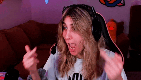a woman wearing headphones and a t-shirt that says n on it