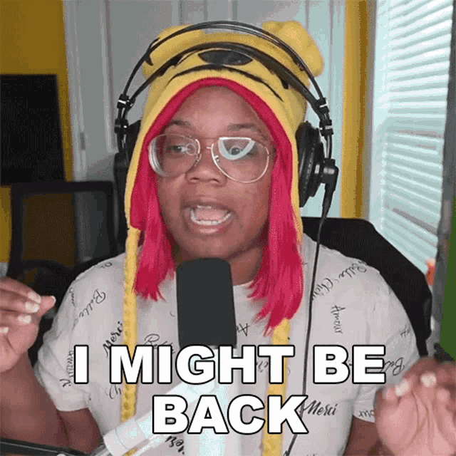 a woman wearing headphones says i might be back