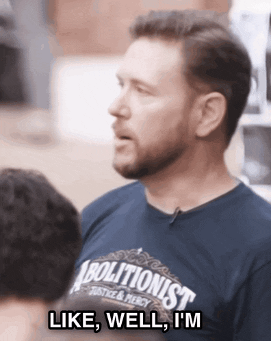 a man wearing a blue shirt that says abolitionist