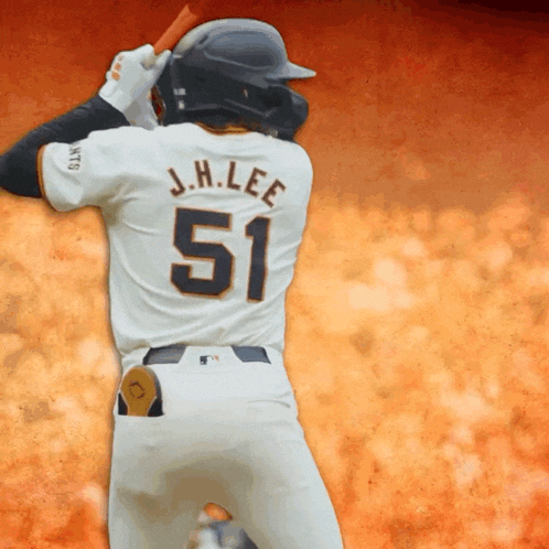a baseball player named j.h. lee is swinging a bat