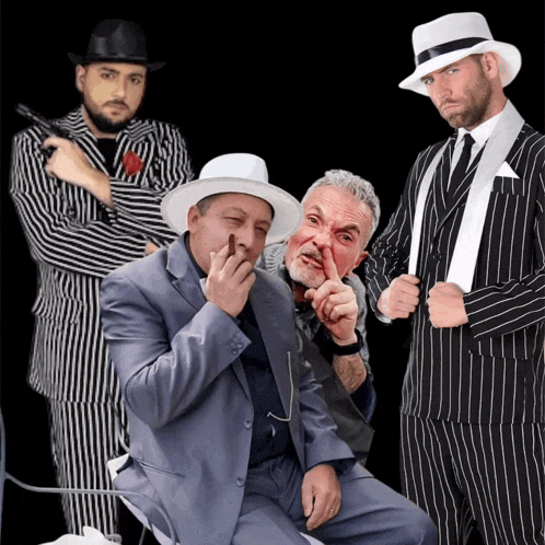 a group of men in suits and hats are posing for a photo