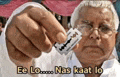 a man is holding a razor blade in his hand and says ee lo nas raat lo .