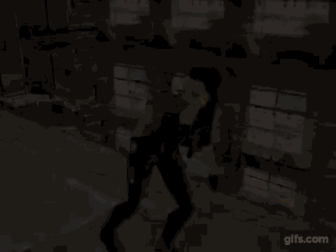 a woman in a video game is holding a gun in her hand and shooting bullets .