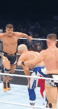 a man in a wrestling ring is wearing a pair of shorts that say power on them