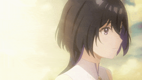 a close up of a girl 's face with dark hair