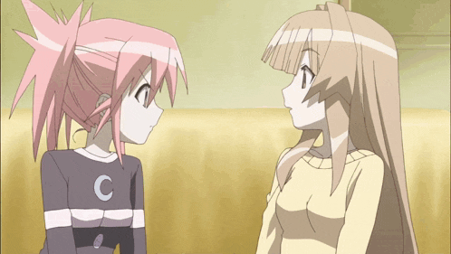 two anime girls are looking at each other with one wearing a sweater with the letter c on it