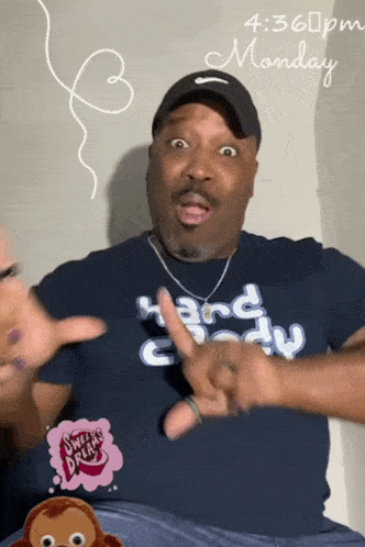 a man wearing a shirt that says hard body