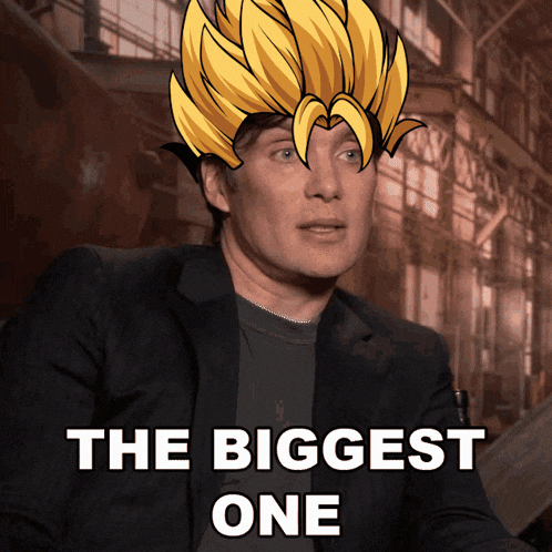 a man in a suit with a cartoon head and the words " the biggest one "