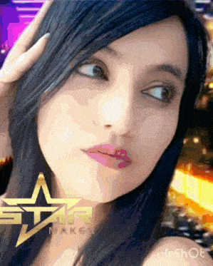 a close up of a woman 's face with a star maker logo in the corner