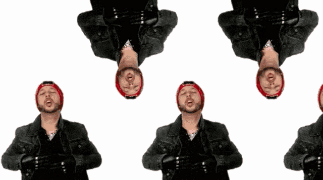 a man with a beard wearing a red hat is standing upside down