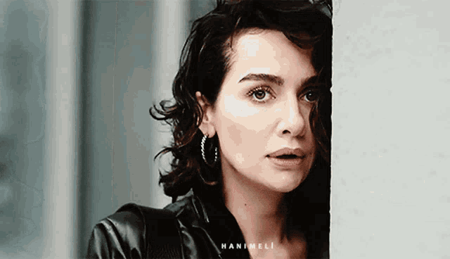 a close up of a woman 's face with the name hanimeli written on the bottom
