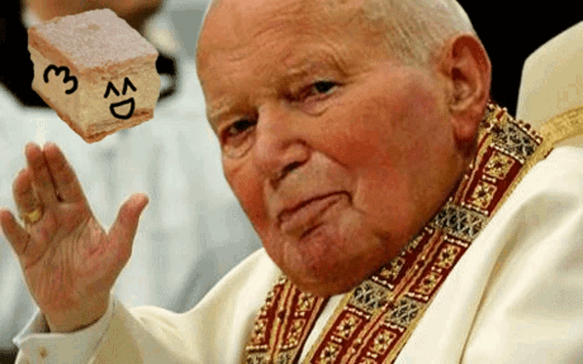 a man in a white robe holds up a piece of cake with the letters e and d on it