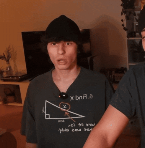 a man wearing a t-shirt that says ' x bni7.e ' on it