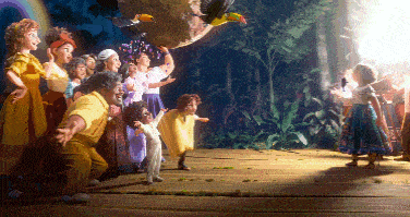 a group of people are standing on a wooden floor in front of a bird flying in the air