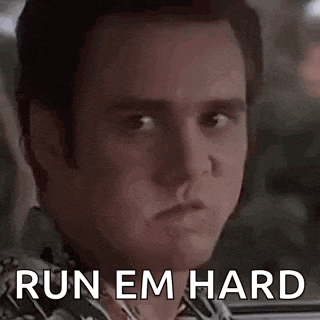 a close up of a man 's face with the words `` run em hard '' on it .