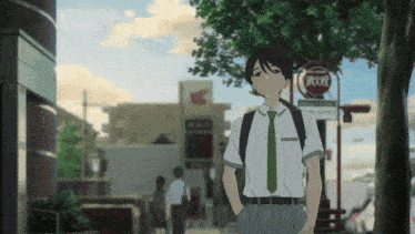 a man in a white shirt and green tie stands in front of a sign that says ' 消火栓 ' on it