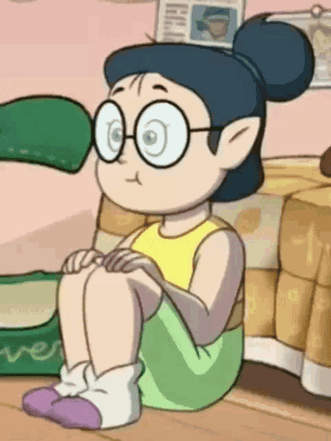 a cartoon girl with glasses is sitting on the floor .