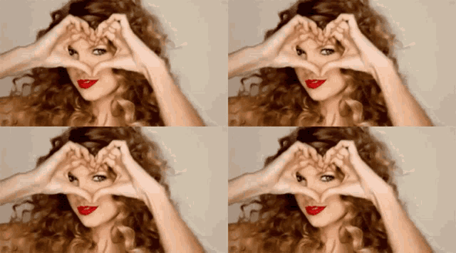 a woman making a heart shape with her hands