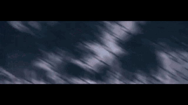 a dark background with a few white lines