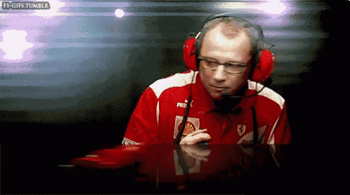 a man wearing headphones and a red shirt that says puma on it