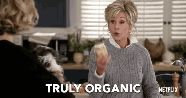 a woman in a grey sweater says truly organic in a netflix advertisement