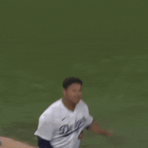 a baseball player wearing a white jersey with the number 48 on the back