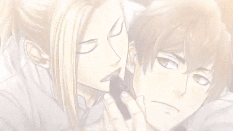 a close up of a man holding another man 's ear