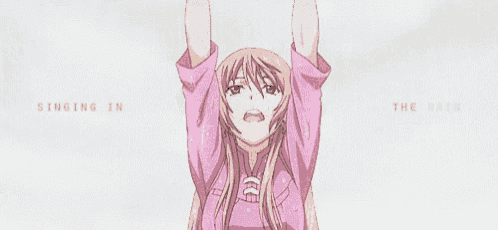 a girl in a pink shirt is hanging upside down with her arms in the air .